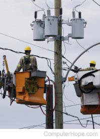 Utility workers fixing electrical power lines